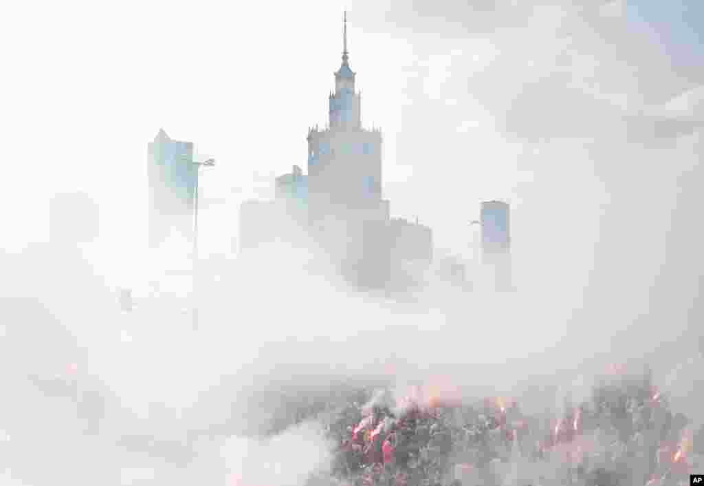 Warsaw residents observe a moment of silence for the fighters and victims of the 1944 Warsaw Rising against Nazi German occupiers, on the 74th anniversary of the revolt, in downtown Warsaw, Poland.