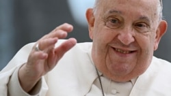 Pope Francis waves during the weekly general audience at St Peter's Square in The Vatican on November 20, 2024. (Photo by Filippo MONTEFORTE / AFP)