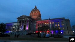 FILE - Lights shine on the Missouri Capitol in Jefferson City, Mo.