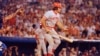 FILE - Pete Rose of the Cincinnati Reds in action at the bat against the Atlanta Braves in Atlanta, Aug. 2, 1978. At left is Atlanta catcher Joe Nolan. 