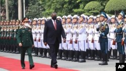 U.S. Secretary of Defense Lloyd Austin with Vietnamese Defense Minister Phan Van Giang, left, inspects an honor guard in Hanoi, Vietnam, Thursday, July 29, 2021. Austin is seeking to bolster ties with Vietnam, one of the Southeast Asian nations…