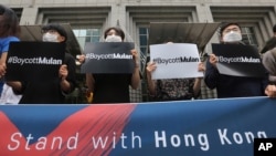 Supporters of Hong Kong protesters stage a rally calling for a boycott of the Disney-produced film "Mulan" outside Walt Disney Korea office in Seoul, South Korea, July 1, 2020.