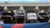 FILE - Supporters of Hong Kong protesters stage a rally calling for a boycott of the Disney-produced film "Mulan" outside Walt Disney Korea office in Seoul, South Korea, July 1, 2020.