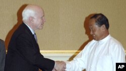 U.S. Sen. John McCain, left, is greeted by Myanmar's Vice President Thiha Thura Tin Aung Myint Oo during their meeting at the President's House in Nay Pyi Taw, Myanmar, June 1, 2011