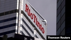 FILE PHOTO: A sign adorns the building where mining company Rio Tinto has their office in Perth, Western Australia