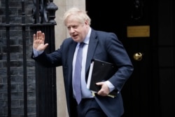 British Prime Minister Boris Johnson leaves 10 Downing Street in London, Feb. 12, 2020.