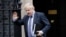 FILE - British Prime Minister Boris Johnson waves as he leaves 10 Downing Street in London, Feb. 12, 2020. Johnson has come under pressure to dismiss adviser Andrew Sabisky, who wrote offensive comments about race and intelligence in 2014 and 2016.