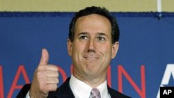 Republican presidential candidate, former Pennsylvania Sen. Rick Santorum gives a thumbs up during his election night party, Tuesday, March 13, 2012, in Lafayette, La. (AP Photo/Eric Gay)