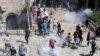 Palestinian protesters participate during a demonstration to show their solidarity amid Israel-Gaza fighting, at Jerusalem's Old City, May 18, 2021.