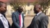 Zanu PF lawyer Lewis Uriri greeting MDC Alliance member Douglas Mwonzora.
