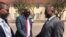 Zanu PF lawyer Lewis Uriri greeting MDC Alliance member Douglas Mwonzora.