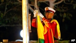 FILE - A Myanmar soldier prepares to hoist a national flag during a ceremony to mark the 71st anniversary of the nation's independence day in Naypyitaw, Myanmar, Jan. 4, 2019. 