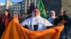 A supporter flashes a victory sign after the jailed leader of the Kurdistan Workers' Party, Abdullah Ocalan, called on the party to disarm and dissolve itself, in Diyarbakir, Turkey, Feb. 27, 2025.