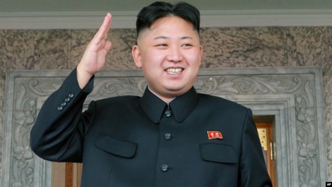 North Korean leader Kim Jong Un watches a military parade held to celebrate the centenary of the birth of the North's founder Kim Il Sung, in Pyongyang on April 15, 