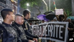 People protest to demand an end to police violence against Black and poor people in Sao Paulo, Dec. 5, 2024. On Saturday, a judge sentenced three former officers of Brazil's Federal Highway Police over the death of a Black man killed by asphyxiation inside an SUV's trunk.