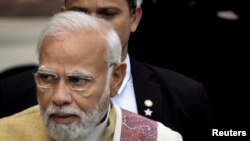 FILE PHOTO: India's Prime Minister Modi speaks with the media inside the parliament premises on the first day of the budget session in New Delhi