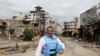 Yacoub El Hillo, a United Nations representative in Syria, reacts to the camera in old Homs city May 8, 2014. 