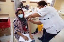 A healthcare worker receives a dose of the Johnson & Johnson vaccine against the COVID-19 coronavirus as South Africa proceeds with its inoculation campaign at the Klerksdorp Hospital on Feb. 18, 2021.