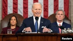 President Joe Biden delivers the State of the Union address to a joint session of Congress at the U.S. Capitol, Feb. 7, 2023, in Washington, as Vice President Kamala Harris and House Speaker Kevin McCarthy of Calif., watch. 