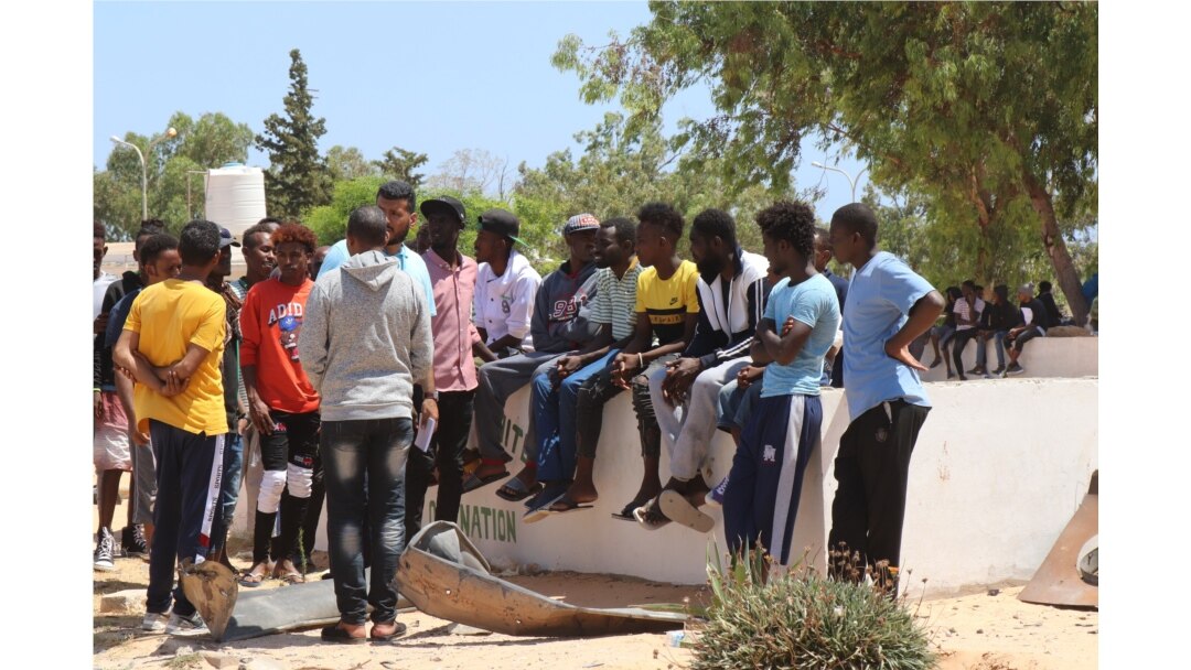Survivors evacuated the crumbled detention center and spent the night outside while officials searched for the injured and the dead on July 3, 2019 in Tripoli, Libya. (H. Murdock)