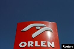 FILE PHOTO: The logo of PKN Orlen, Poland's top oil refiner, is pictured at a petrol station in Warsaw, Poland, April 25, 2019.