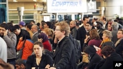 Passengers wait for check-in at Cairo's international airport, Egypt, January 31, 2011