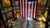 A large flag hangs from the ceiling as people vote at the San Francisco Columbarium & Funeral Home in San Francisco, Nov. 5, 2024.