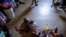 People shelter inside a school after their settlement was burned down by gangs in Port-au-Prince, July 27, 2021.