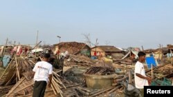 မိုခါမုန်တိုင်းတိုက်ခတ်အပြီး စစ်တွေမြို့တစ်နေရာ (ဓာတ်ပုံ - Partners Relief and Development/Handout via REUTERS)