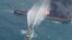 A rescue ship works to extinguish the fire on the Iranian oil tanker Sanchi in the East China Sea, Jan. 10, 2018.