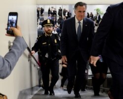 Sen. Mitt Romney, R-Utah, walks through the Senate subway on his way to the Senate impeachment trial of President Donald Trump in Washington, Jan. 29, 2020.