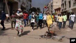 FILE - In Dakar, Senegal, on Feb. 9, 2024, demonstrators protest President Macky Sall's decision to postpone the presidential vote scheduled for Feb. 25.