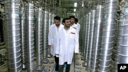 Iranian President Mahmoud Ahmadinejad tours a nuclear facility in Iran. 