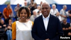 FILE - Director Raoul Peck and producer Laurence Lascary pose during a photocall for the documentary film "Ernest Cole: Lost and Found" presented as part of Special Screenings at the 77th Cannes Film Festival in Cannes, France, May 21, 2024.