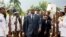 FILE - Haiti's President Jovenel Moise, center, leaves the museum during a ceremony marking the 215th anniversary of revolutionary hero Toussaint Louverture's death, at the National Pantheon museum in Port-au-Prince.