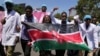 FILE—Doctors and other medical staff take part in a protest, in downtown Nairobi, Kenya, March. 22, 2024. 