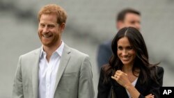 Britain's Prince Harry and his wife Meghan, Duchess of Sussex.