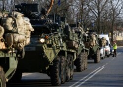 FILE - A convoy of U.S. troops, a part of NATO's reinforcement of its eastern flank, drive from Germany to Orzysz in northeast Poland, March 28, 2017.