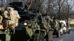 FILE - A convoy of U.S. troops, a part of NATO's reinforcement of its eastern flank, drive from Germany to Orzysz in northeast Poland, March 28, 2017.