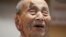 Yasutaro Koide, the 112-year-old living in the central Japanese city of Nagoya, smiles upon being formally recognized as the world's oldest man by the Guinness World Records at a nursing home in Nagoya, Aug. 21, 2015.