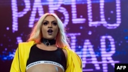 FILE - Brazilian singer and drag queen Pabllo Vittar performs in her concert at the Vivo Rio in Rio de Janeiro, Brazil, Oct. 21, 2017.