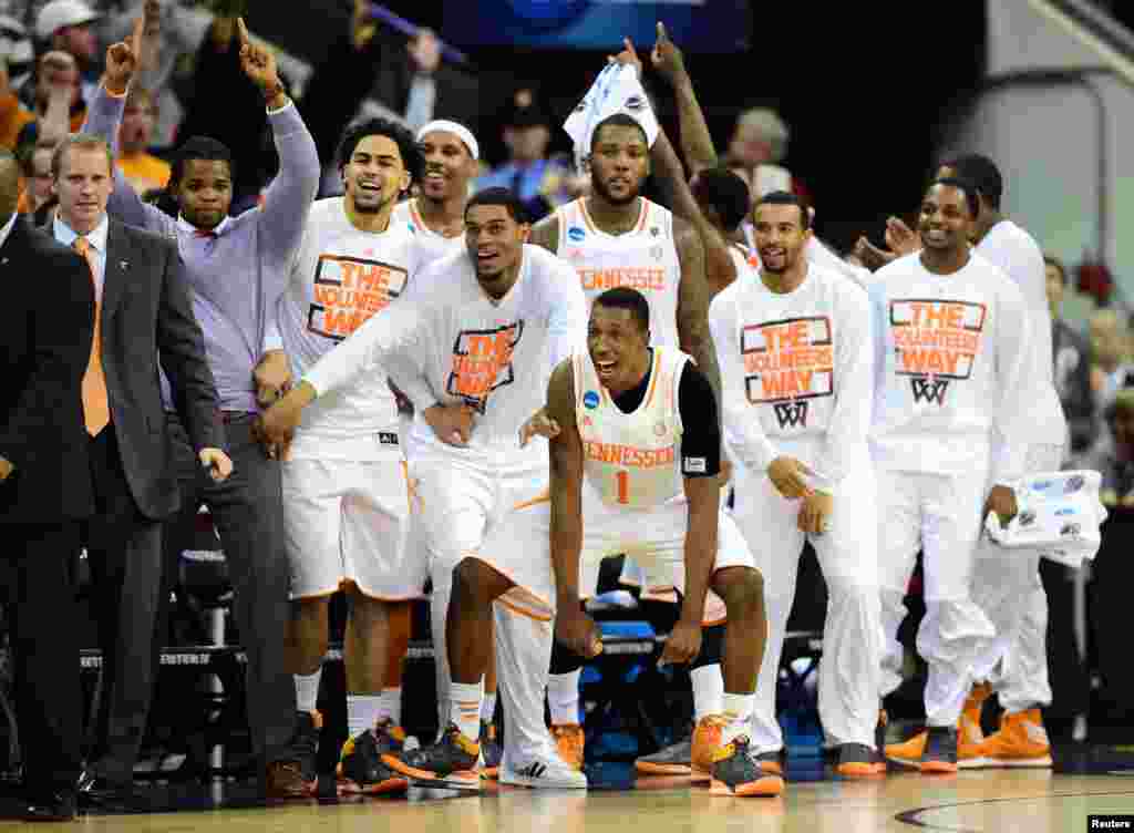 The Tennessee Volunteers bench celebrates in the closing second against the Mercer Bears in a men's college basketball game during the third round of the 2014 NCAA Tournament at PNC Arena in Raleigh, NC, March 23, 2014.