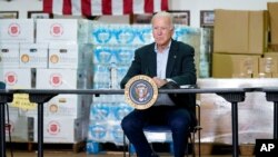 President Joe Biden listens during a briefing about damage caused by remnants of Hurricane Ida, in Hillsborough Township, New Jersey, Sept. 7, 2021.