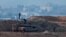 Israeli soldiers stand on a tank, ahead of a ceasefire between Israel and Hamas, as seen from the Israeli side of the border with Gaza on Jan. 16, 2025.