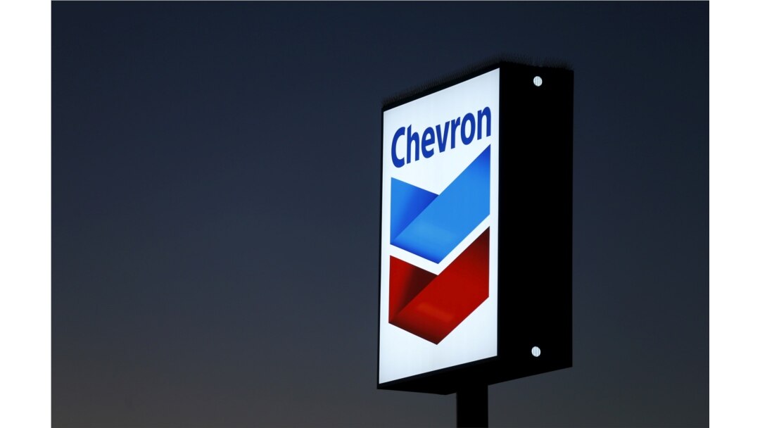 FILE - A Chevron gas station sign is shown in Cardiff, California, Jan. 25, 2016.