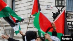 Pro-Palestinian demonstrators protest during a demonstration following a flare-up of Israeli-Palestinian violence, in London, Britain, May 16, 2021.