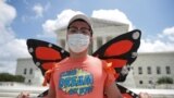 DACA recipient Luis Zuluaga celebrates outside the U.S. Supreme Court 