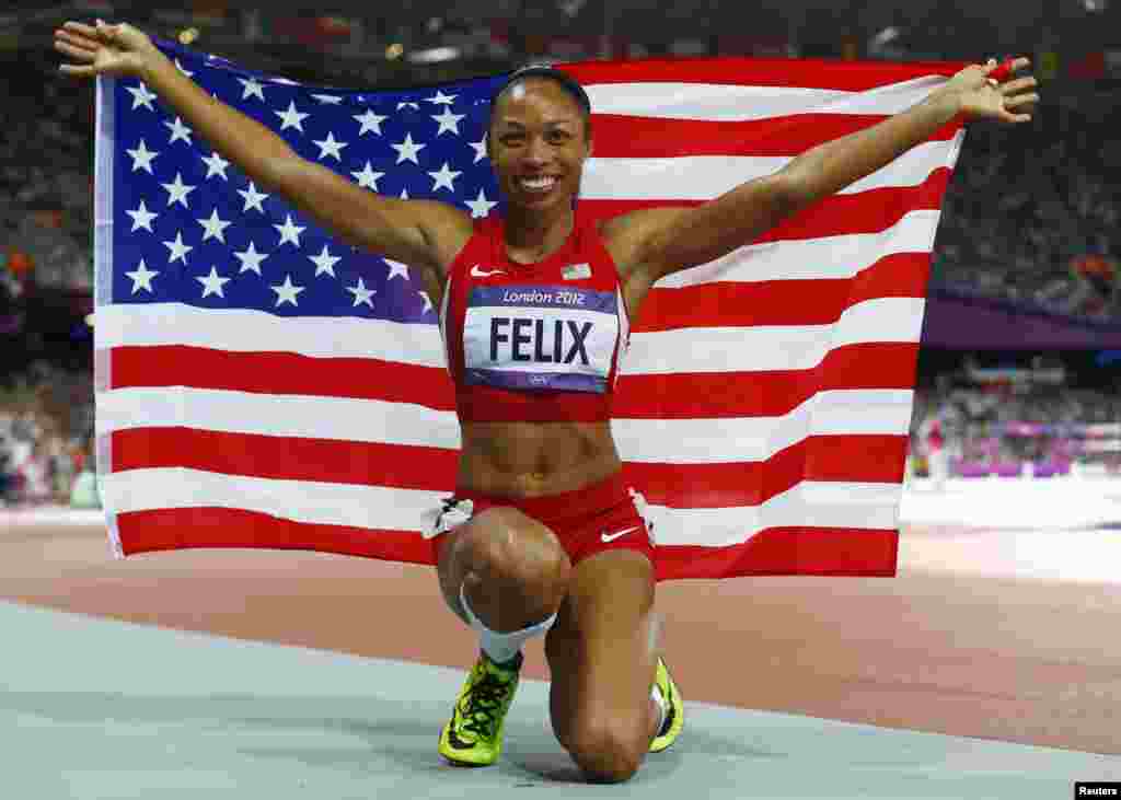 Allyson Felix of the U.S. celebrates after winning gold in the women's 200m final during the London 2012 Olympic Games at the Olympic Stadium August 8, 2012. 