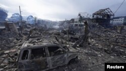 일본 이시카와현 와지마시 지진 피해 현장에 2일 불탄 차량과 상업용 건물 잔해가 방치돼 있다.