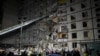 Police officers and State Emergency Service of Ukraine rescuers work at an apartment building damaged after an airstrike in Kharkiv, on Oct. 31, 2024.